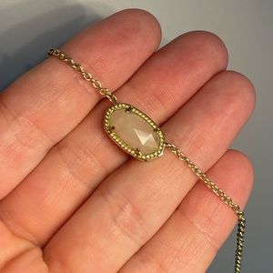 gold and pink necklace